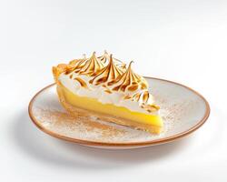 a slice of lemon meringue pie on a white plate photo