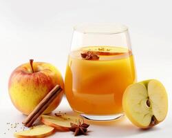 a glass of apple juice and some apples photo