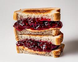 a stack of toasted bread with jam on top photo