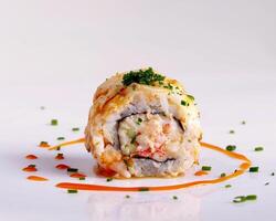 a sushi roll with a sauce on top photo