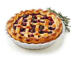 a pie with cherries and rosemary on a white background photo