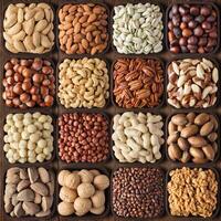 assorted nuts on wooden table background. composition organic food in square bowls, top view. photo