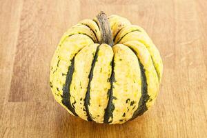 Ripe raw fresh decorative pumpkin photo