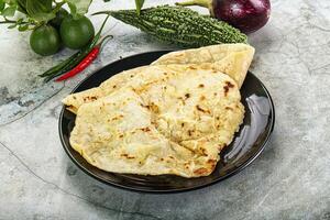 Indian tandori bread - naan with cheese photo