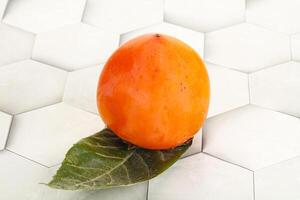 Fresh ripe sweet juicy persimmon photo