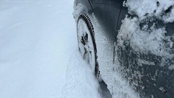 Powerful SUV vehicle struggling to maintain traction and control on the winter country road with fresh snow video