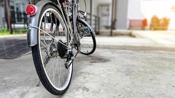 Close up parts of old school dark brown bicycle photo