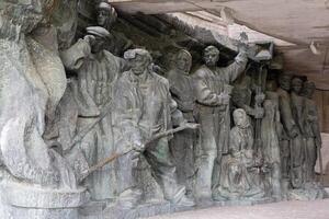A sculptural composition about partisans, and the labor feat of the rear. Museum of the Great Patriotic War. The museum was founded in the USSR, 1981. photo