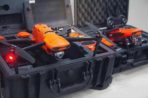 A drone with a camera in a box on a store shelf photo