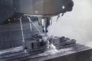 Auto CNC turning with robot drill milling factory with water coolant streams photo