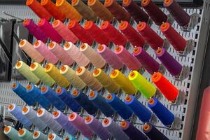 Multi-colored threads on a stand close-up. photo