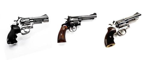 Three revolvers with different handle materials and designs, isolated on a white background photo