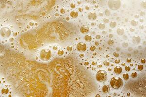 Close-Up of Bubbles in Orange Liquid. photo