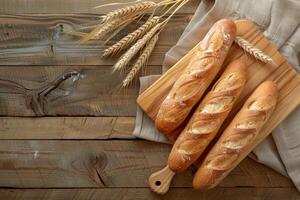 Rustic Bread and Wheat on Wooden Table. photo