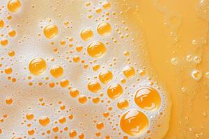 Close-Up of Bubbles in Orange Liquid. photo