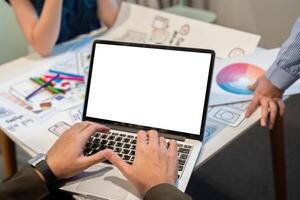 Website designer, Creative planning phone app development template layout framework wireframe design, Young asian man UX designer working on laptop white mock up screen at office photo