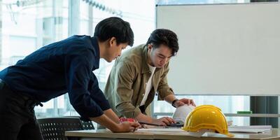 Construction and structure of engineer or architect meeting for project working with partner and tools on model building and blueprint in working site photo