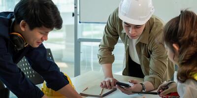 Construction and structure of engineer or architect meeting for project working with partner and tools on model building and blueprint in working site photo