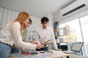 Creative UX Developer and UI Designer Team Brainstorming Ideas in Modern Office Environment photo