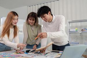 Creative UX Developer and UI Designer Team Brainstorming Innovative Ideas in Modern Office Environment photo
