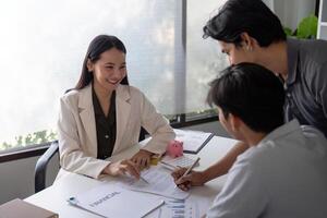 Gay Couple Planning Finance with Advisor, Signing Contracts, and Investing for Future photo