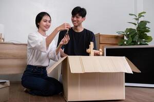 Happy Couple Unpacking Boxes in Their New Home, Starting a New Chapter Together in a Modern House photo