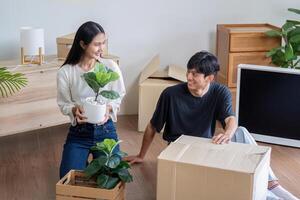 Happy Couple Unpacking Boxes and Moving into New Home, Starting Fresh in Modern Living Space photo