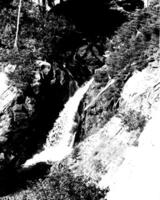 Waterfall and the mountain river background. Waterscape natural environment black and white photo background