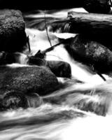 Waterfall and the mountain river background. Waterscape natural environment black and white photo background