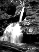 Waterfall and the mountain river background. Waterscape natural environment black and white photo background