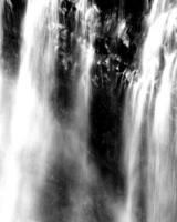 Waterfall and the mountain river background. Waterscape natural environment black and white photo background