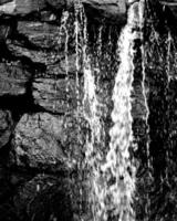 Waterfall and the mountain river background. Waterscape natural environment black and white photo background