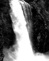 Waterfall and the mountain river background. Waterscape natural environment black and white photo background