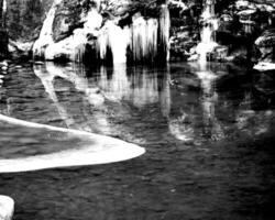 Waterfall and the mountain river background. Waterscape natural environment black and white photo background