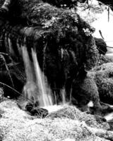 Waterfall and the mountain river background. Waterscape natural environment black and white photo background