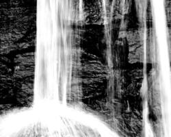 Waterfall and the mountain river background. Waterscape natural environment black and white photo background