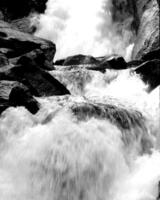 Waterfall and the mountain river background. Waterscape natural environment black and white photo background