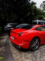 Milan, Italy, June 18, 2024 - red luxurious Ferrari photo