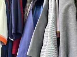 many colorful clothes in the store photo