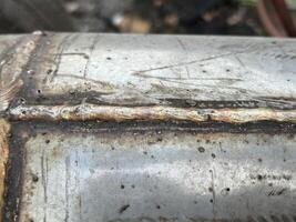 old rusty metal pipe , metal tube, welding steel photo