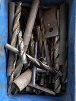 metal tools in box on the floor photo
