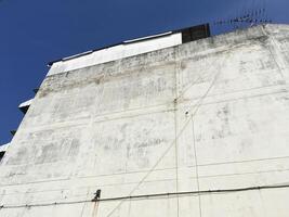the roof of a building with old cement wall photo