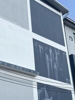 white concrete building with black and grey concrete wall background, construction concept. photo