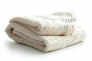 Folded white cotton towel isolated on white background. photo