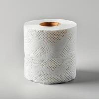 Roll of white toilet paper with embossed design. photo