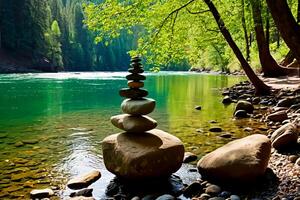 Showing the art of rock balancing on the river bank. In the background, a calm flowing river reflects the colors of the natural stones carefully stacked on its banks. photo