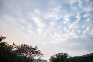 orange blue skyscape background with cloud and silhouette city town building in evening of the day sunset twilight dusk time photo