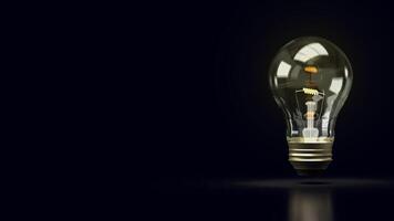 The light bulb in black background for technology or idea concept 3d rendering. photo