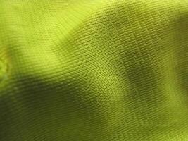 a close up of a yellow fabric photo