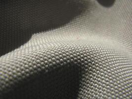 a close up of a gray fabric photo